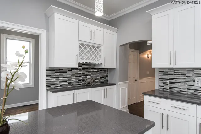a kitchen with stainless steel appliances granite countertop a stove and a refrigerator