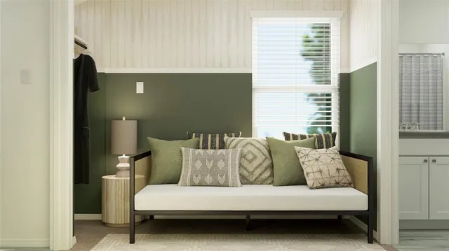 a bedroom with a bed and a couch