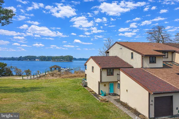 a view of a wooden deck with a lake view