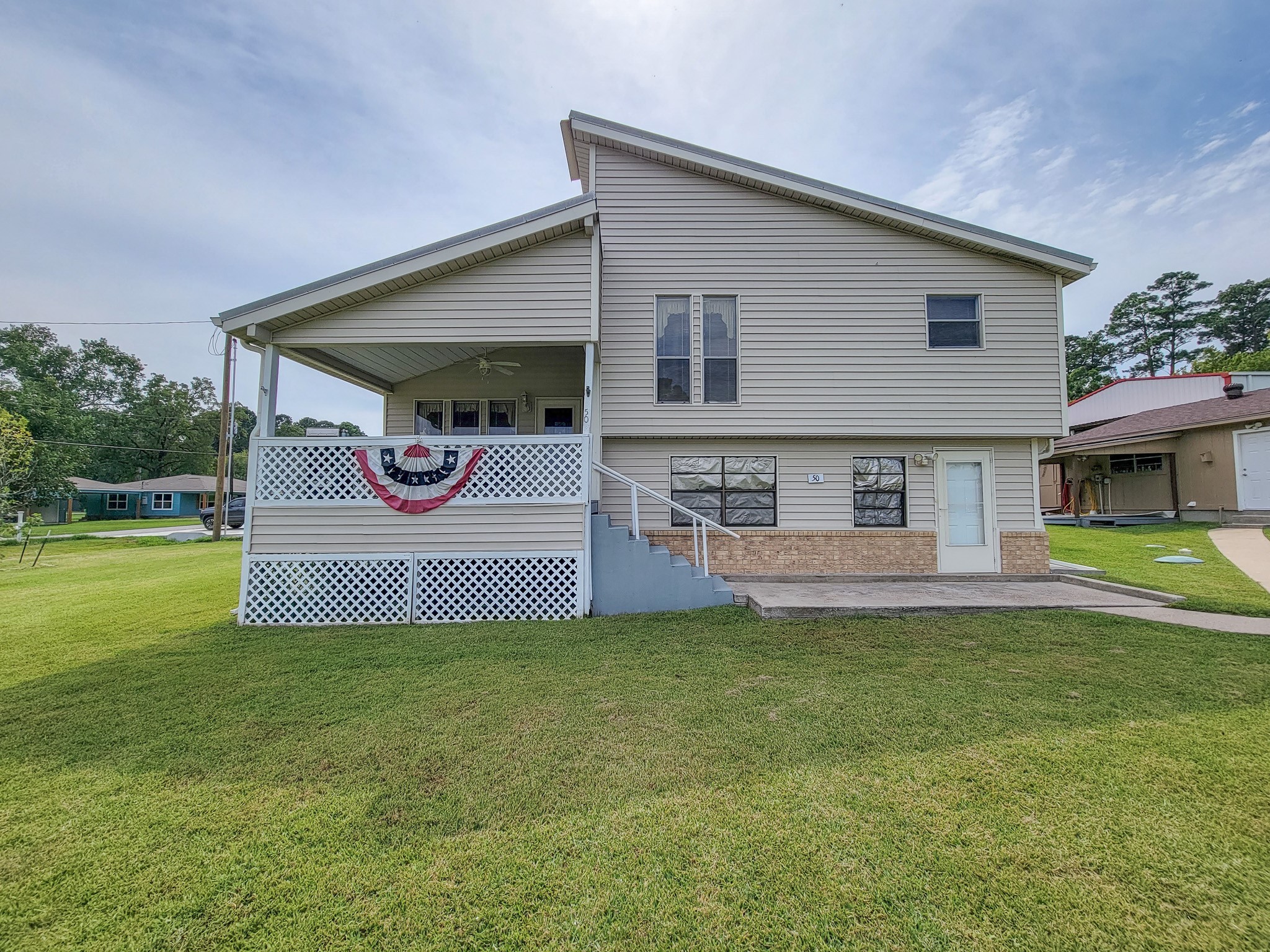 50 Sportsman Trail Coldspring, TX 77331 - Photo 1 of 42 a front view of a house with a yard and garage