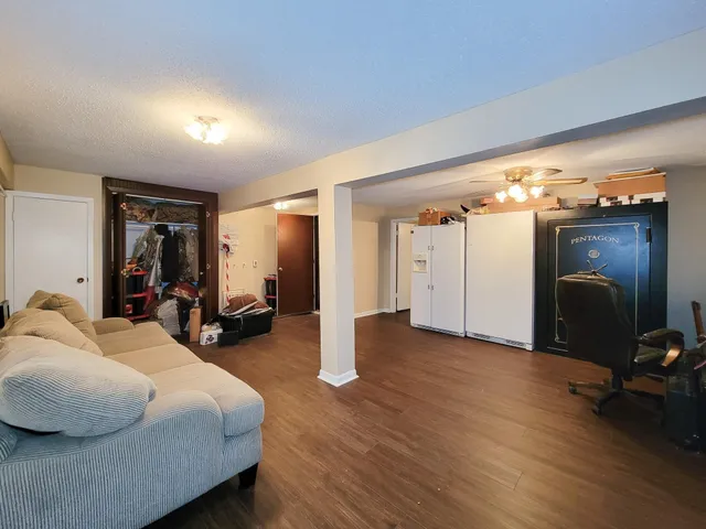 a bed room with furniture and a window