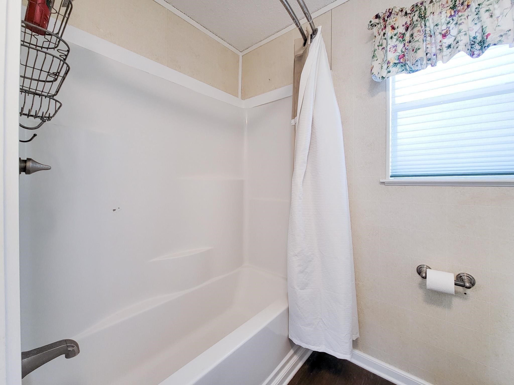 50 Sportsman Trail Coldspring, TX 77331 - Photo 25 of 42 a bathroom with a bathtub and a shower
