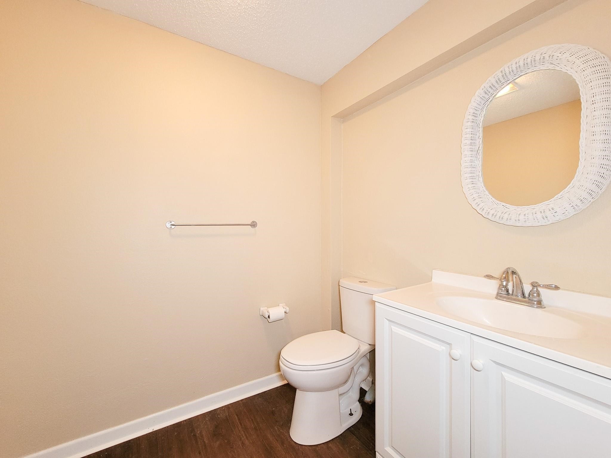 50 Sportsman Trail Coldspring, TX 77331 - Photo 26 of 42 a bathroom with a toilet a sink and mirror