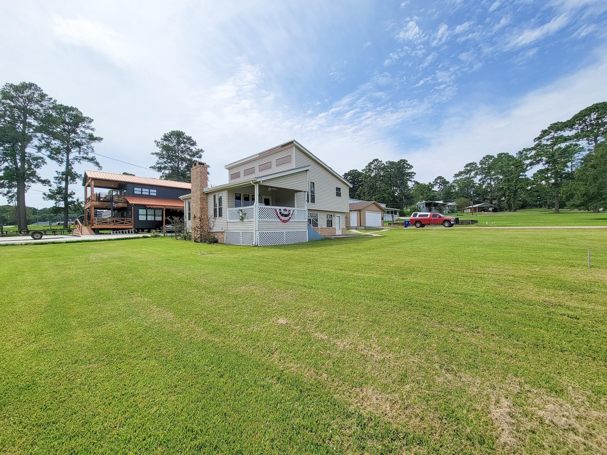 50 Sportsman Trail Coldspring, TX 77331 - Photo 33 of 42 a view of a house with a big yard and large trees