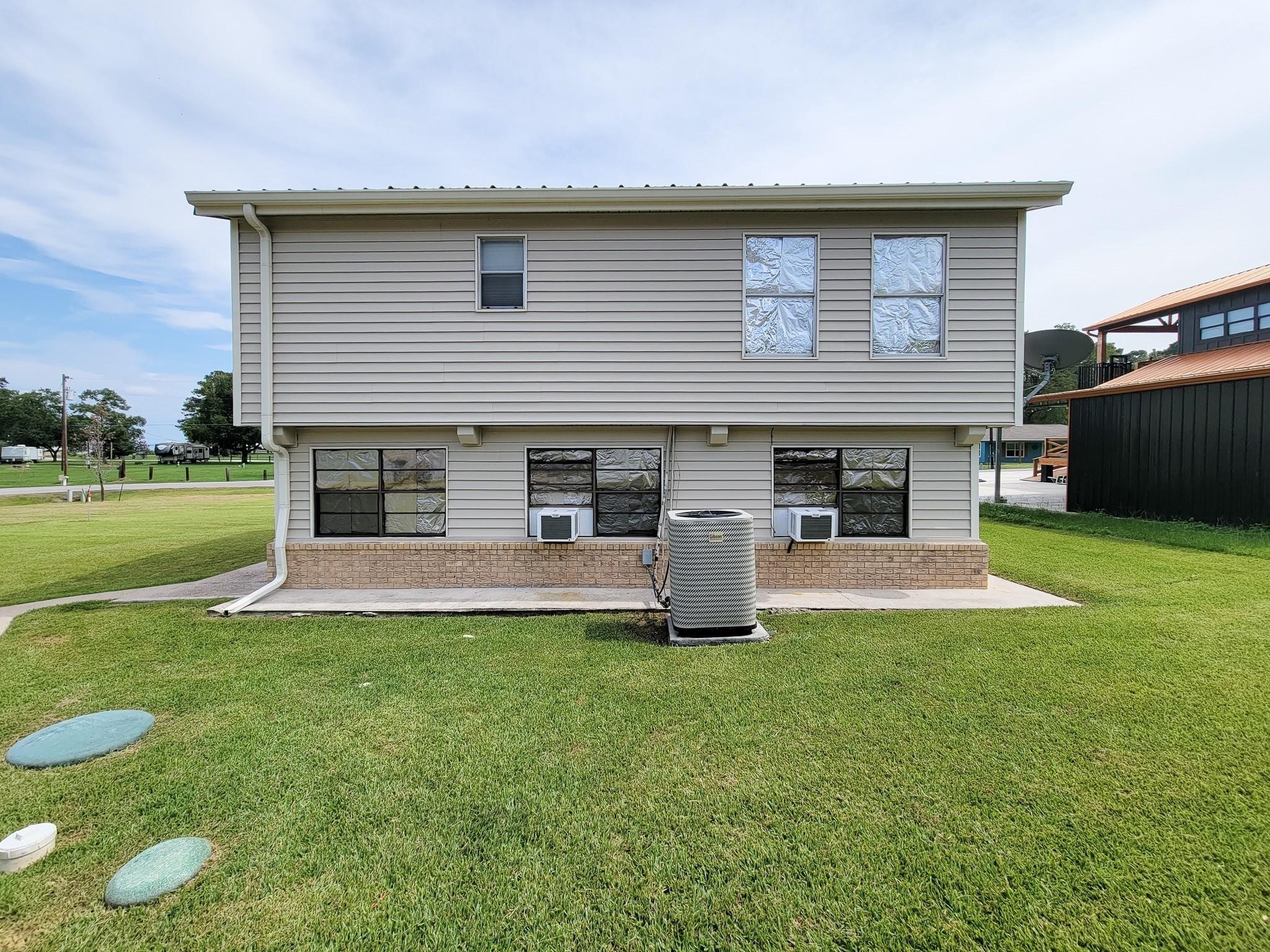 50 Sportsman Trail Coldspring, TX 77331 - Photo 34 of 42 a front view of a house with a garden and yard