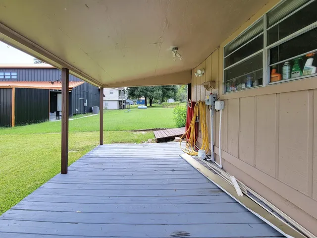 a view of a backyard of the house