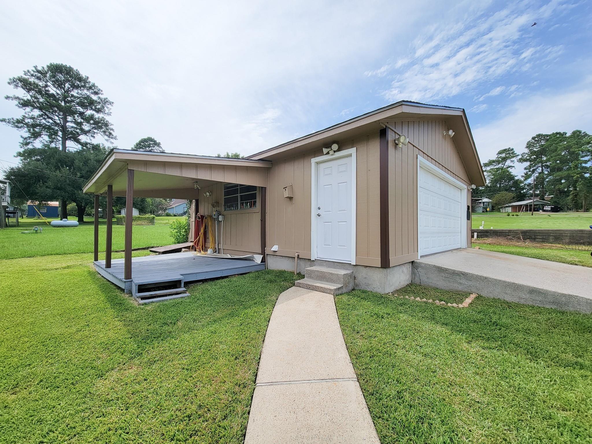 50 Sportsman Trail Coldspring, TX 77331 - Photo 36 of 42 a front view of a house with garden