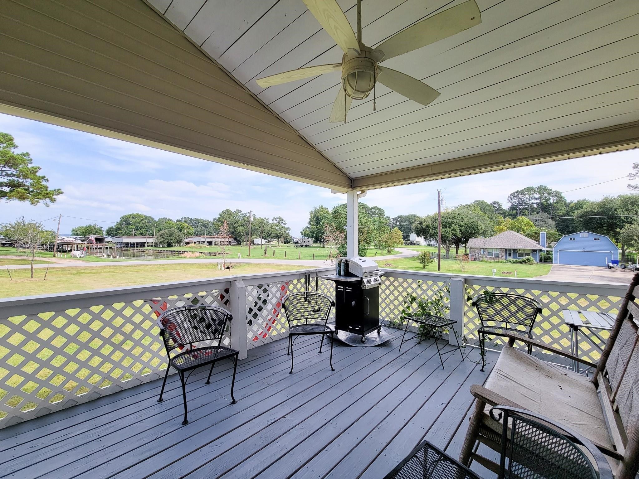 50 Sportsman Trail Coldspring, TX 77331 - Photo 4 of 42 a view of a chairs and table on the terrace