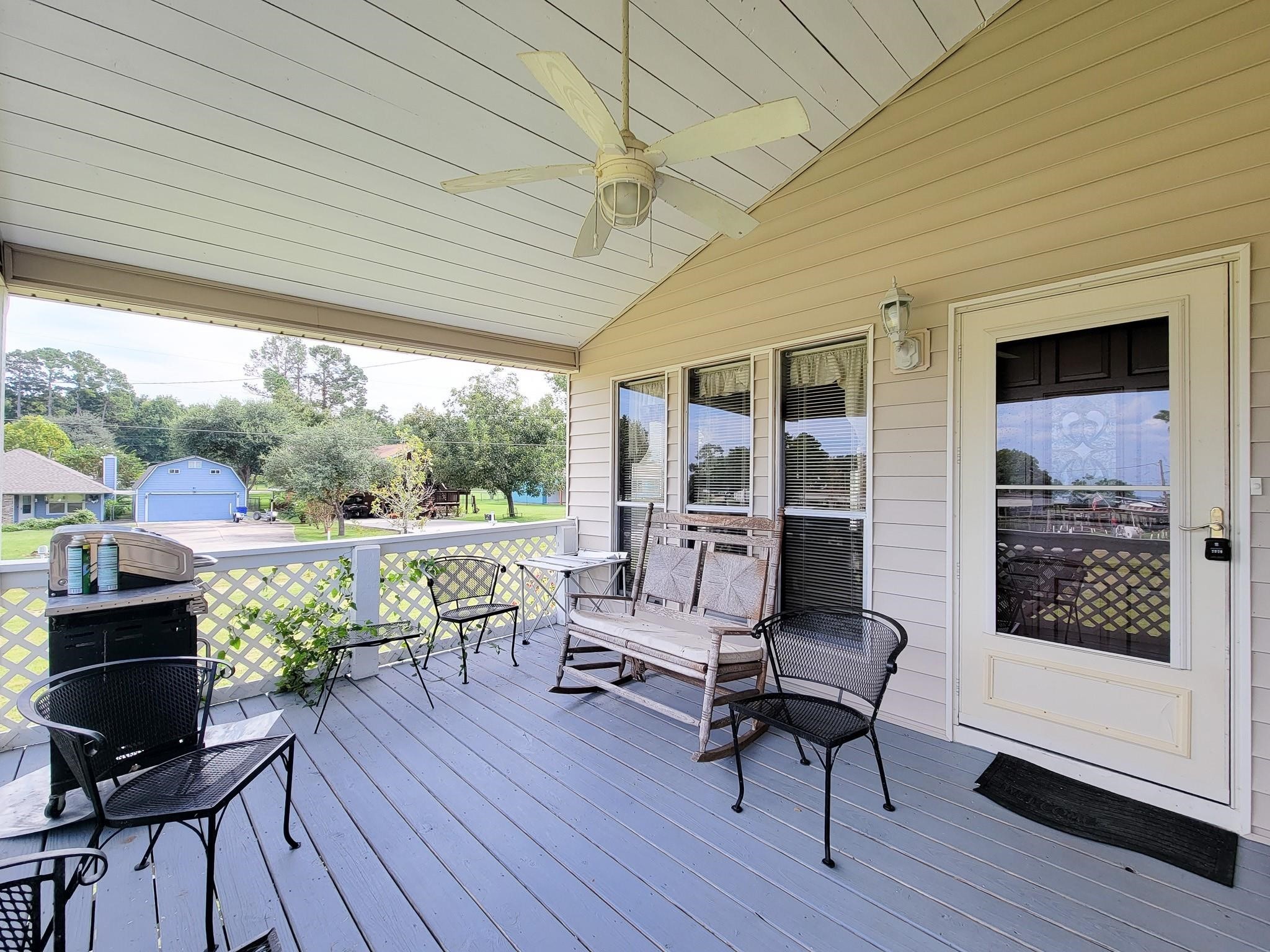 50 Sportsman Trail Coldspring, TX 77331 - Photo 5 of 42 a living room with furniture and a floor to ceiling window