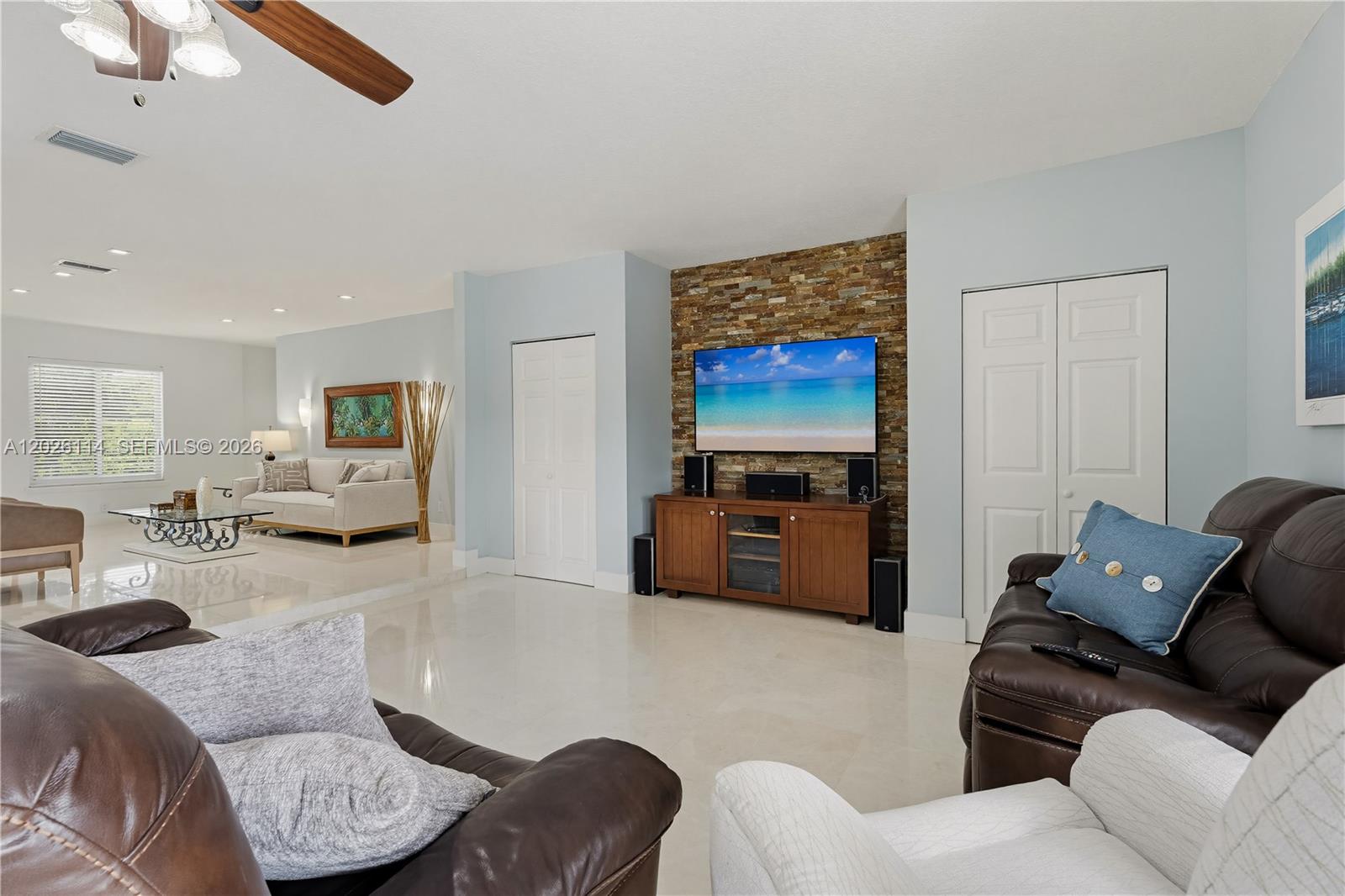 9641 Southwest 66th Street Miami, FL 33173 - Photo 16 of 57 a living room with furniture and a couch