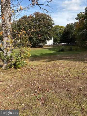 a view of a field with an ocean view