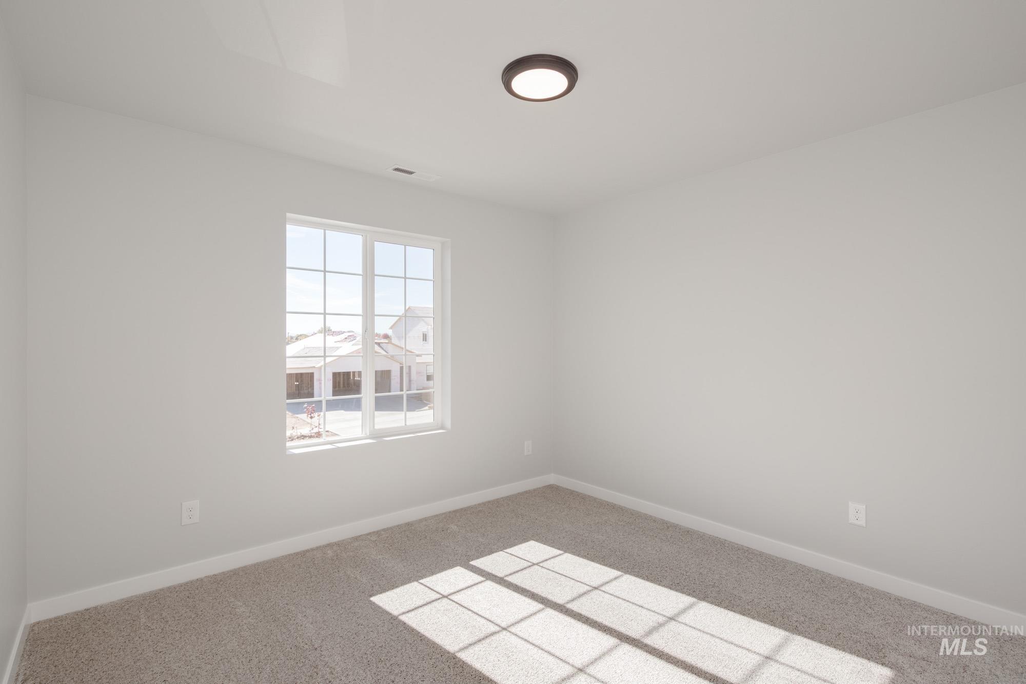 3230 South Maple Rnch Way Nampa, ID 83686 - Photo 23 of 27 Carpeted empty room with baseboards