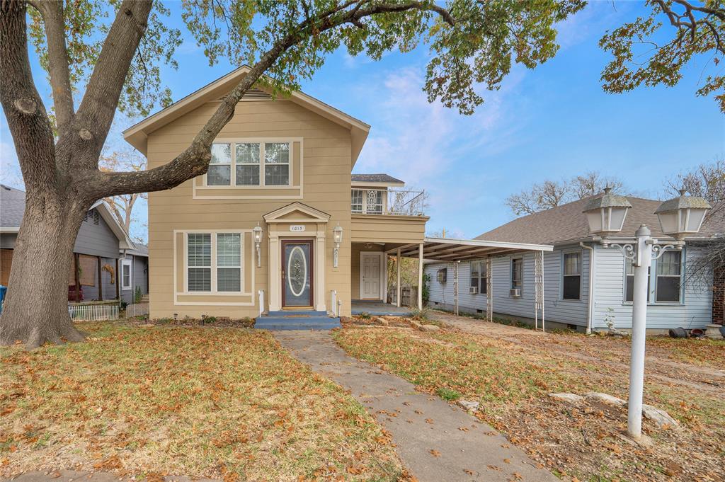 1015 West Walker Street Denison, TX 75020 - Photo 1 of 1 a front view of a house with a yard