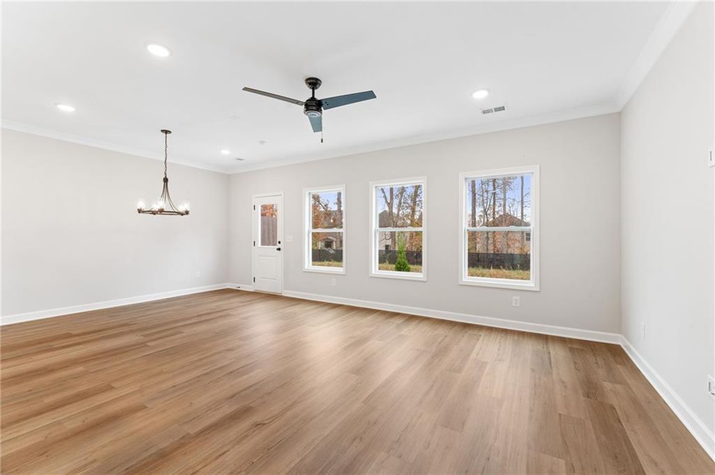 328 Colsen Drive Acworth, GA 30102 - Photo 11 of 28 a view of empty room with wooden floor and fan
