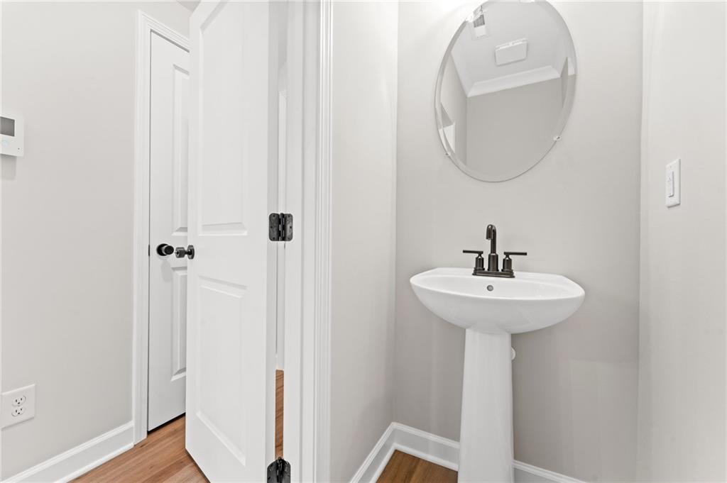 328 Colsen Drive Acworth, GA 30102 - Photo 17 of 28 a bathroom with a sink a mirror and shower