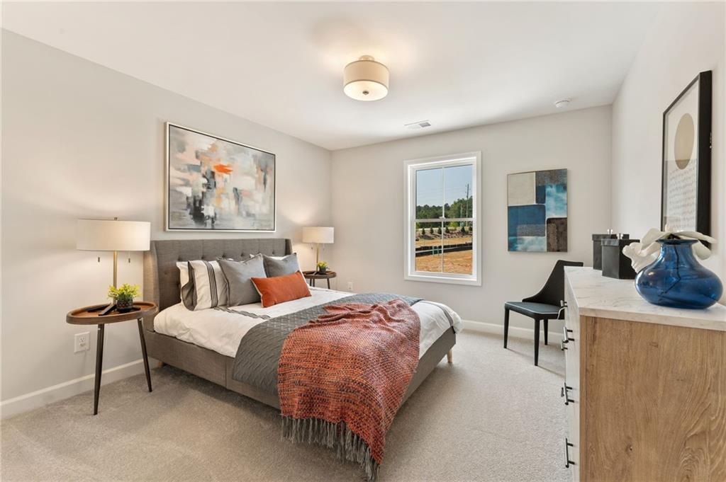 328 Colsen Drive Acworth, GA 30102 - Photo 23 of 28 a bedroom with a bed and wooden floor