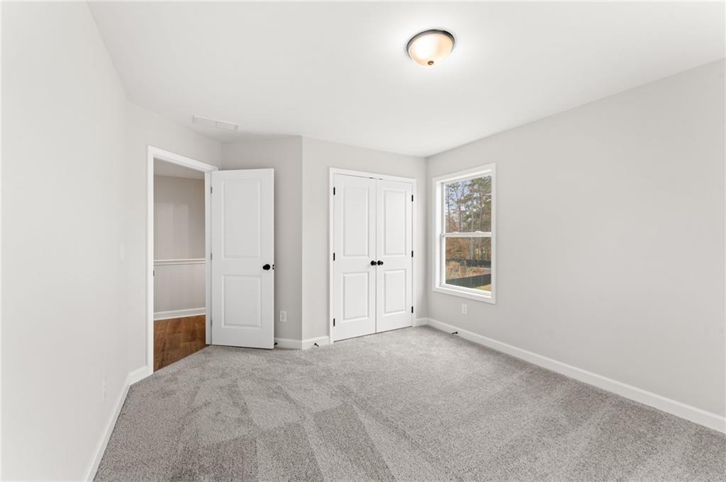 328 Colsen Drive Acworth, GA 30102 - Photo 27 of 28 a view of an empty room with a window