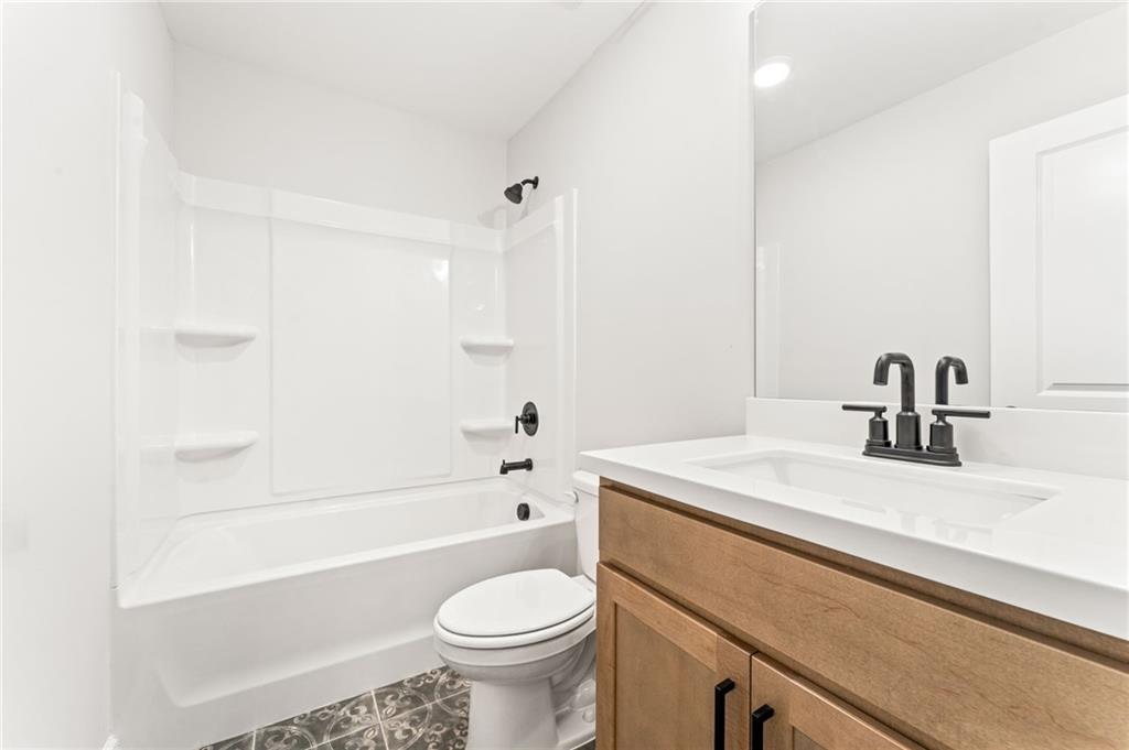 328 Colsen Drive Acworth, GA 30102 - Photo 28 of 28 a bathroom with a sink a toilet and a bathtub