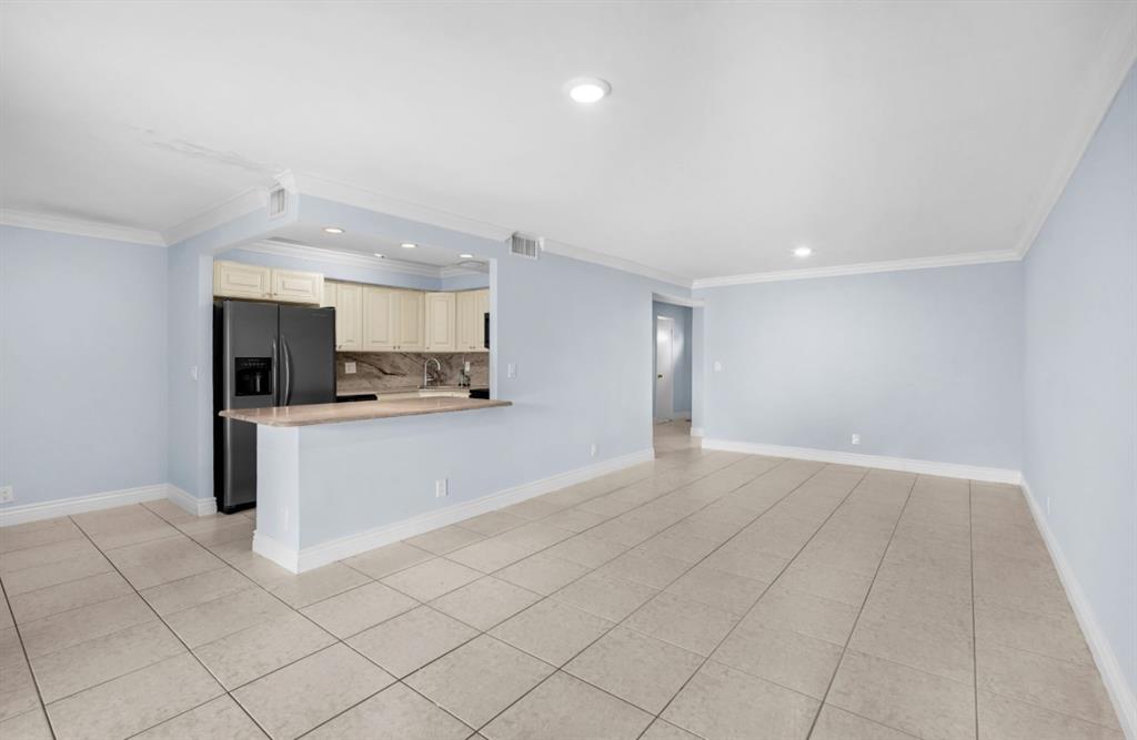1321 Partridge Close, Unit 60 Pompano Beach, FL 33064 - Photo 15 of 28 a view of kitchen with refrigerator sink and cabinets