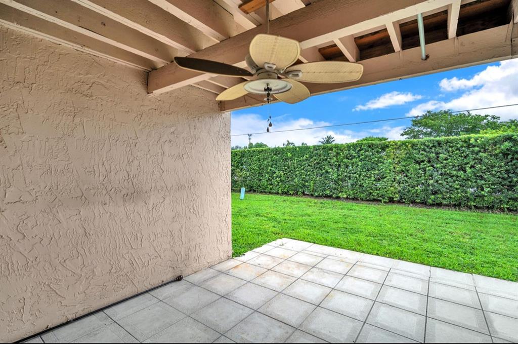1321 Partridge Close, Unit 60 Pompano Beach, FL 33064 - Photo 2 of 28 a view of an entryway with a garden