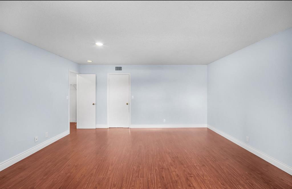 1321 Partridge Close, Unit 60 Pompano Beach, FL 33064 - Photo 21 of 28 a view of a room with wooden floor