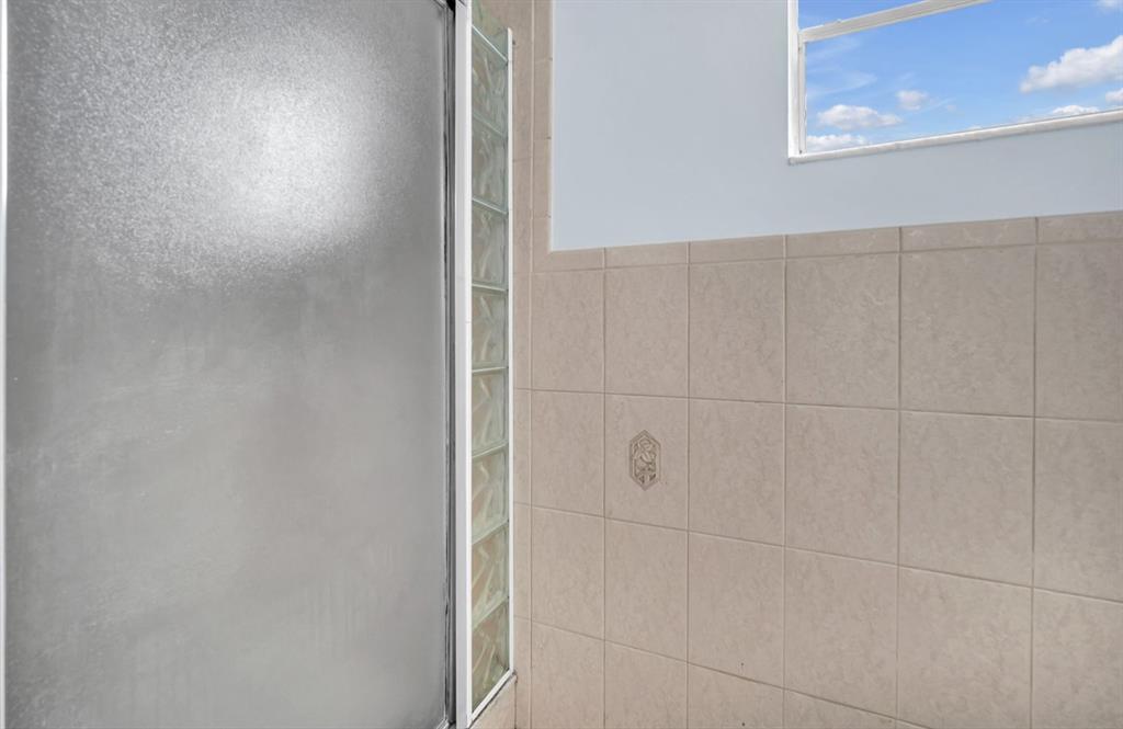 1321 Partridge Close, Unit 60 Pompano Beach, FL 33064 - Photo 23 of 28 a bathroom with a shower