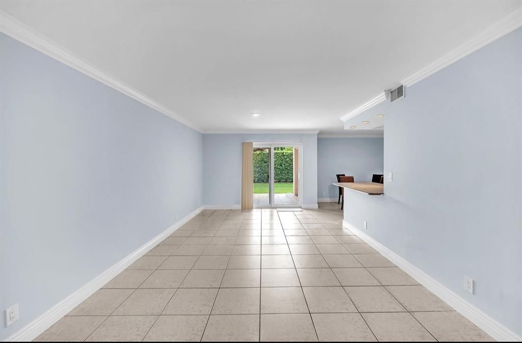 1321 Partridge Close, Unit 60 Pompano Beach, FL 33064 - Photo 6 of 28 a view of an empty room with a window