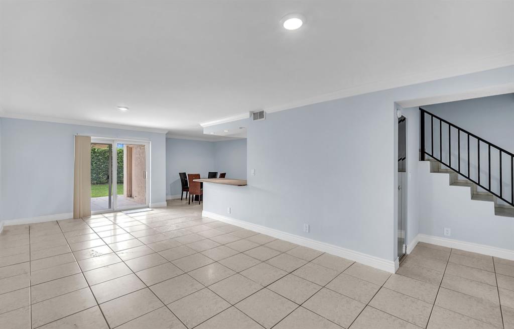 1321 Partridge Close, Unit 60 Pompano Beach, FL 33064 - Photo 7 of 28 a view of an empty room and window