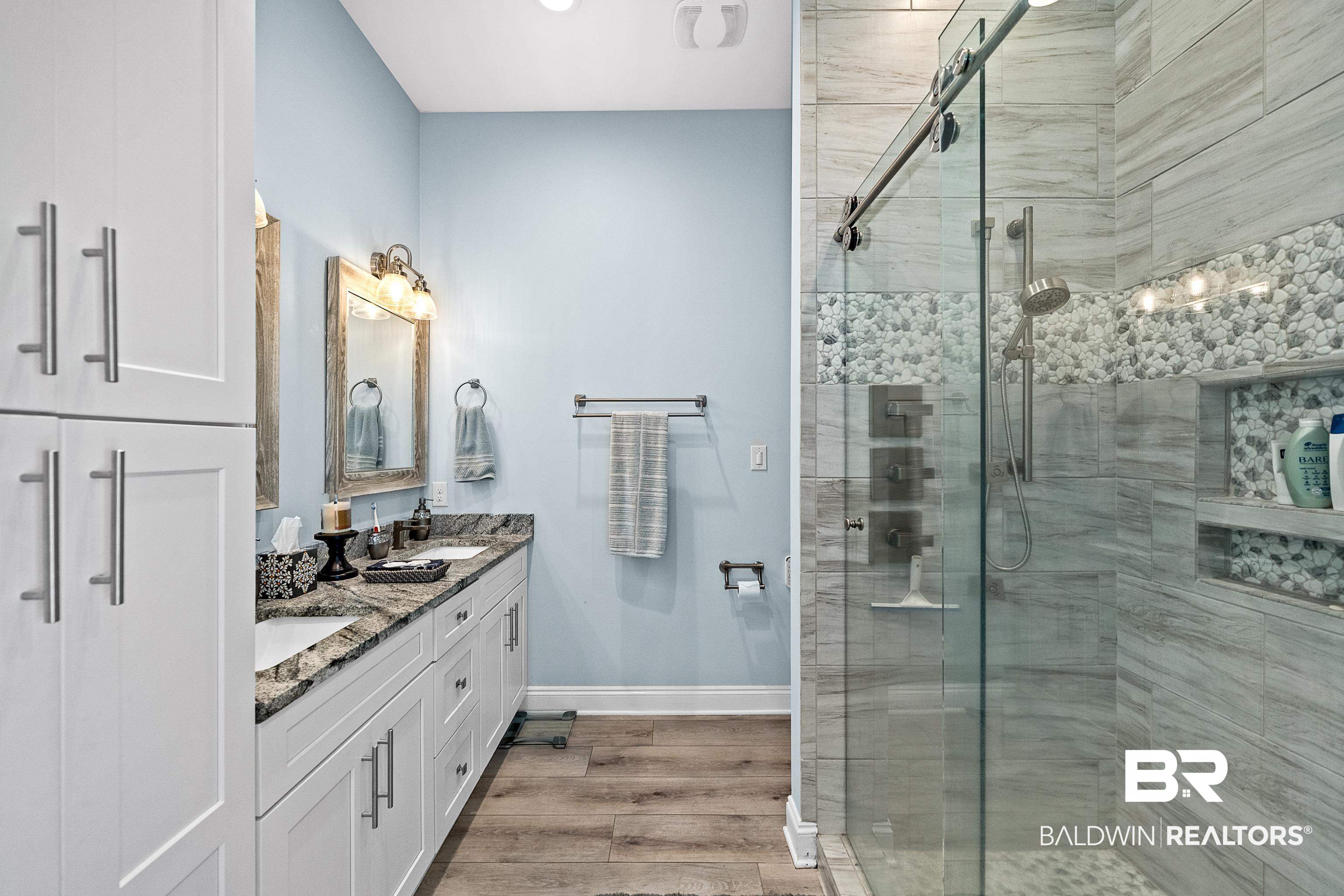 12329 Reunion Place, Unit LOT 38 Foley, AL 36535 - Photo 12 of 43 Full bathroom with a stall shower, double vanity, and light wood-style flooring