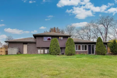 a view of a house with a garden