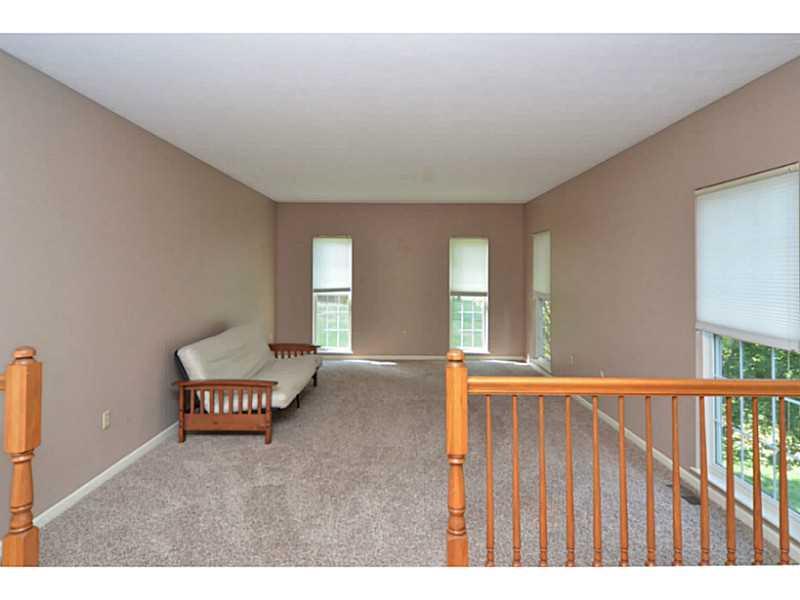 Family Room. The family room is neutral in decor and includes large windows that offer plenty of light.