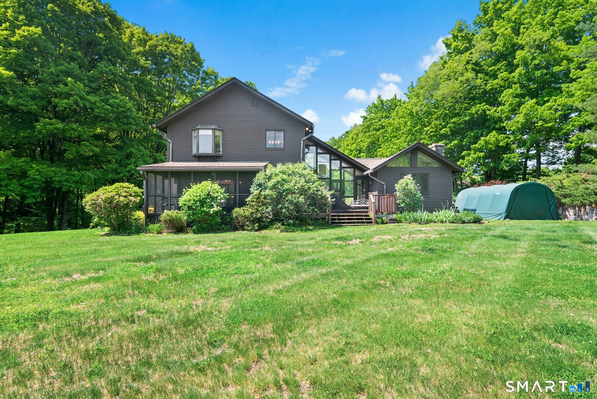127 Huntingtown Road Newtown, CT 06470 - Photo 26 of 38 a front view of a house with garden