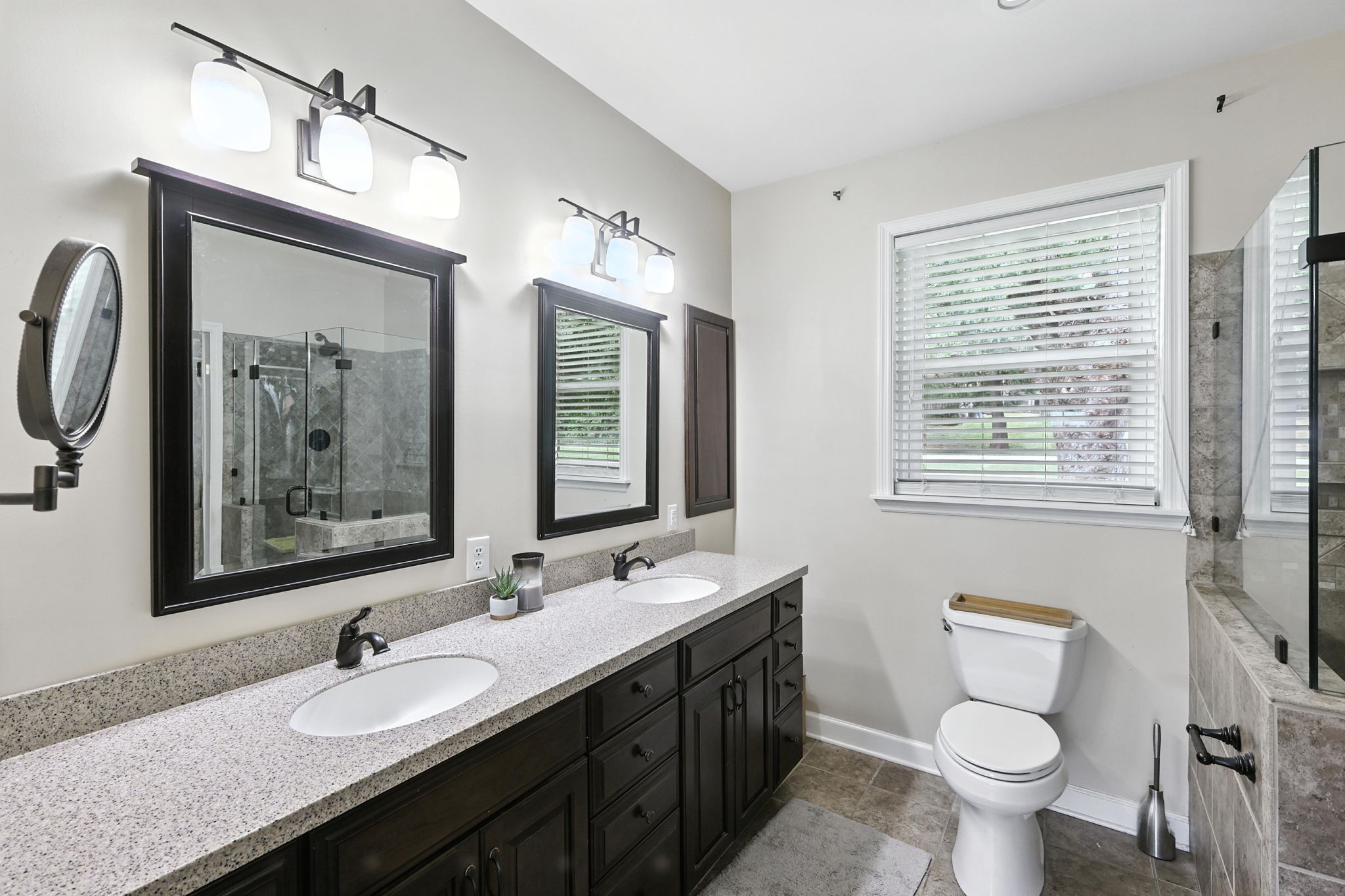 763 Bellevue Road Nashville, TN 37221 - Photo 11 of 24 a bathroom with a double vanity sink toilet and a mirror