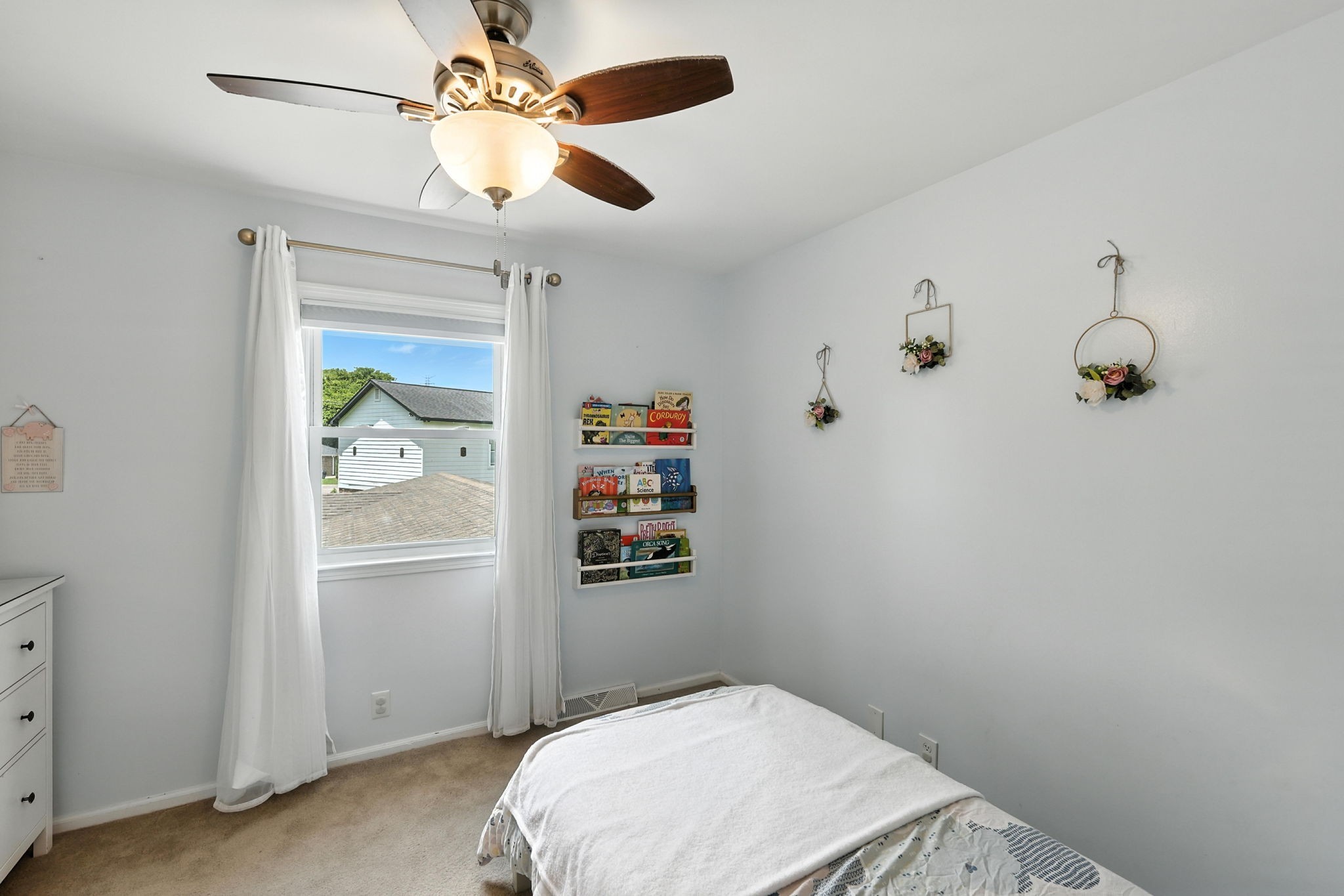 763 Bellevue Road Nashville, TN 37221 - Photo 13 of 24 a bedroom with a bed and a chandelier