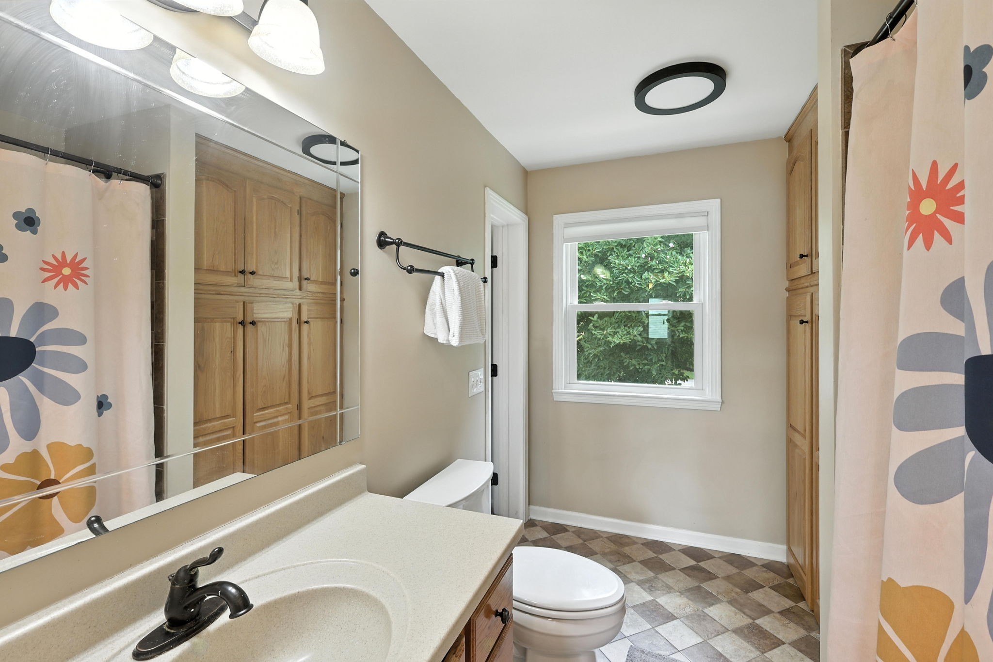 763 Bellevue Road Nashville, TN 37221 - Photo 18 of 24 a bathroom with a sink a toilet and shower