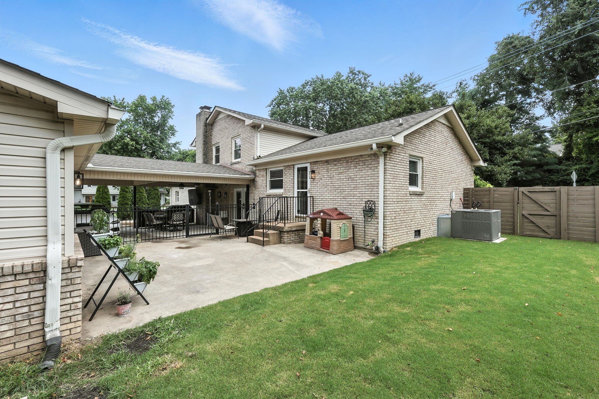 763 Bellevue Road Nashville, TN 37221 - Photo 2 of 24 a view of a house with backyard and porch
