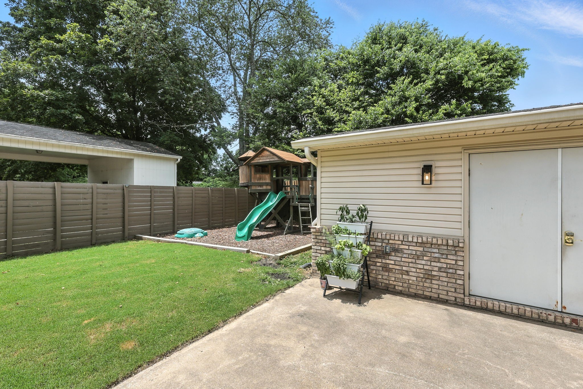 763 Bellevue Road Nashville, TN 37221 - Photo 22 of 24 a view of a house with backyard and a tree