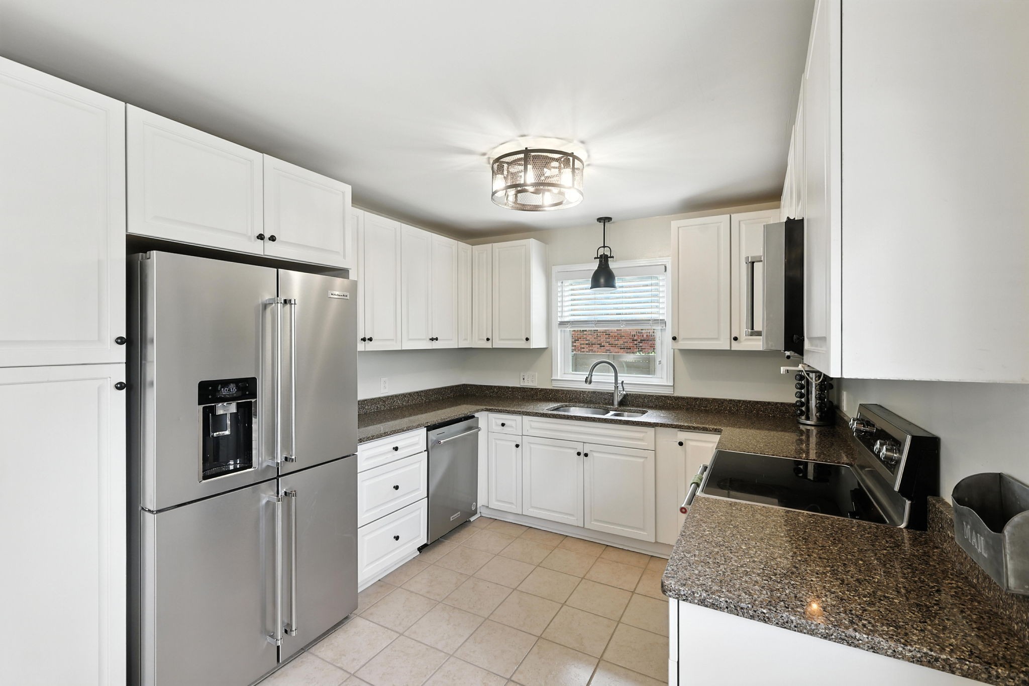 763 Bellevue Road Nashville, TN 37221 - Photo 5 of 24 a kitchen with granite countertop a sink a counter space appliances and cabinets