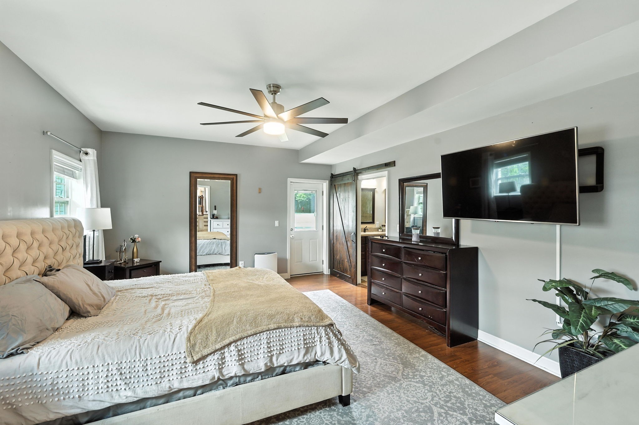 763 Bellevue Road Nashville, TN 37221 - Photo 8 of 24 a spacious bedroom with a bed and a flat screen television