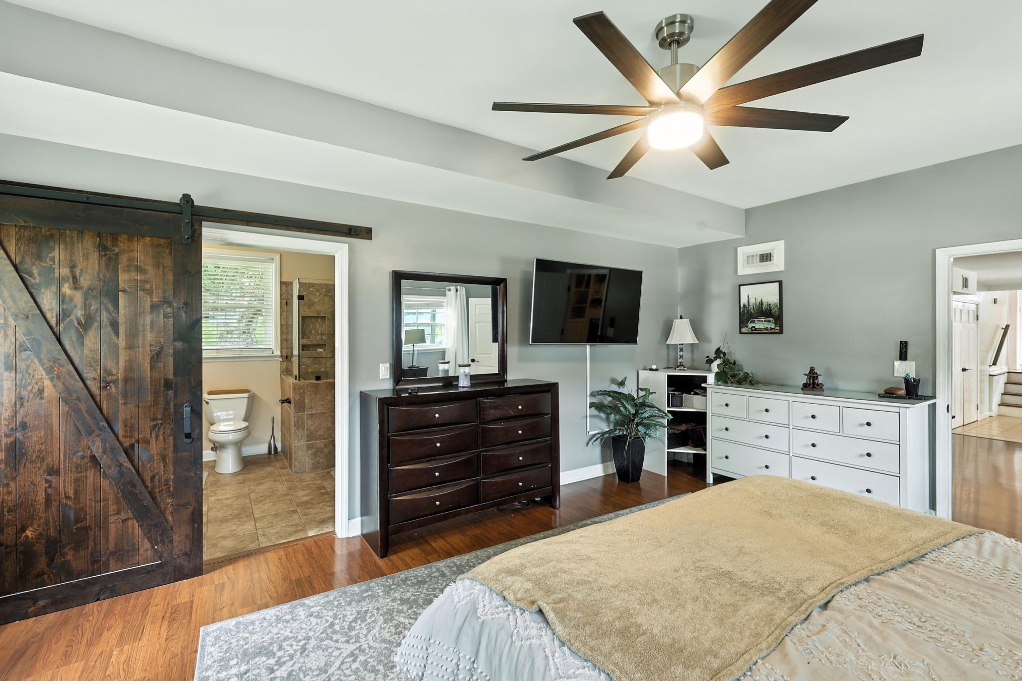 763 Bellevue Road Nashville, TN 37221 - Photo 9 of 24 a bed room with a bed and a television