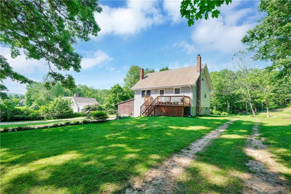 20 Dunay Road Stafford, CT 06076 - Photo 1 of 1 a view of a house with a big yard and potted plants