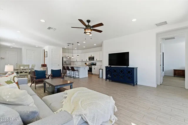 a spacious bedroom with a bed and a window