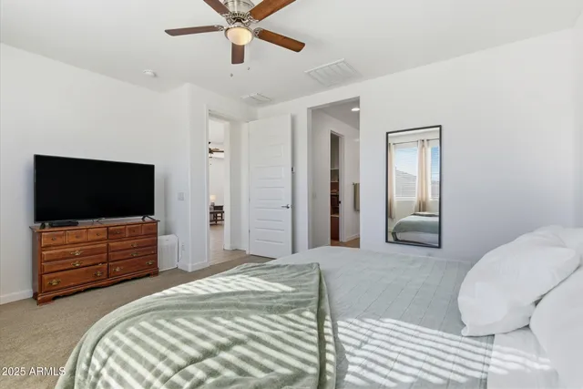 a bathroom with a double vanity sink a mirror and a shower