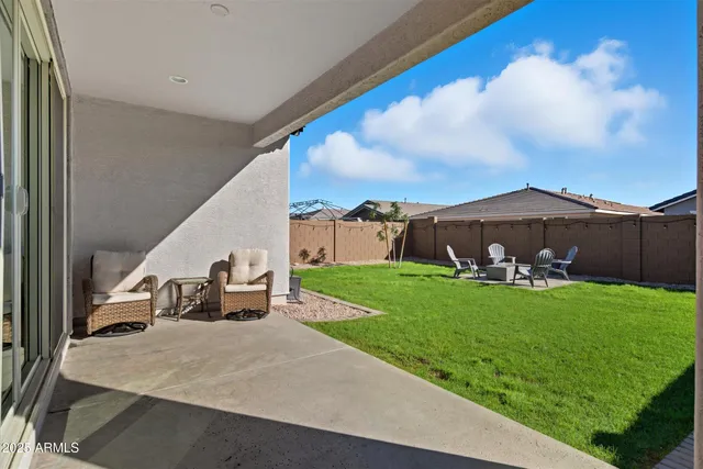 a view of living room with patio furniture and city view