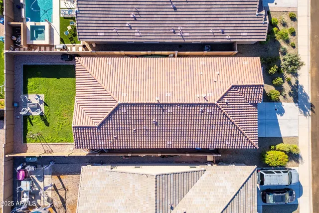 a view of a patio with table and chairs potted plants and lake view