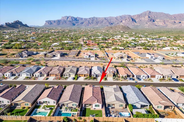 an aerial view of a residential houses with outdoor space