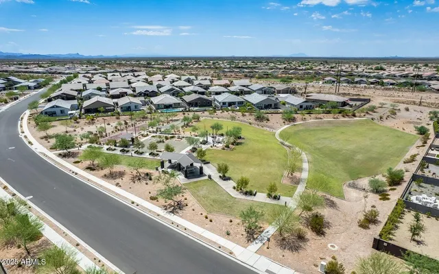 a view of a backyard with sitting area