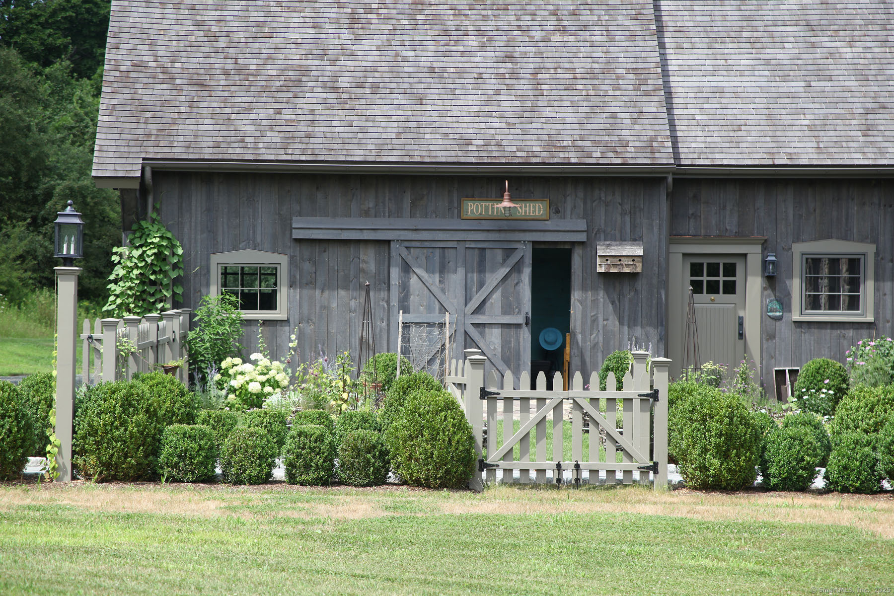 103 B Chalybes Road West Roxbury, CT 06783 - Photo 3 of 38 a front view of a house with garden