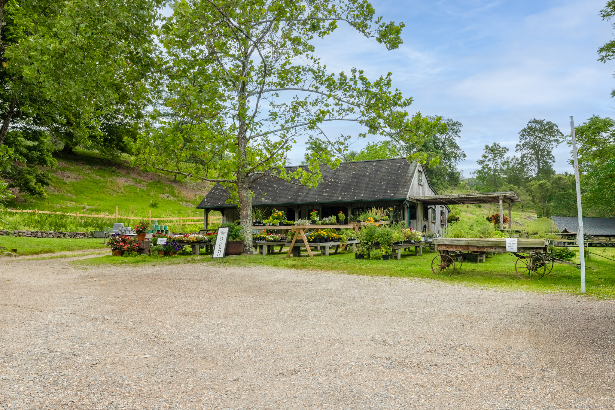 103 B Chalybes Road West Roxbury, CT 06783 - Photo 33 of 38 a view of a house with a yard and sitting area