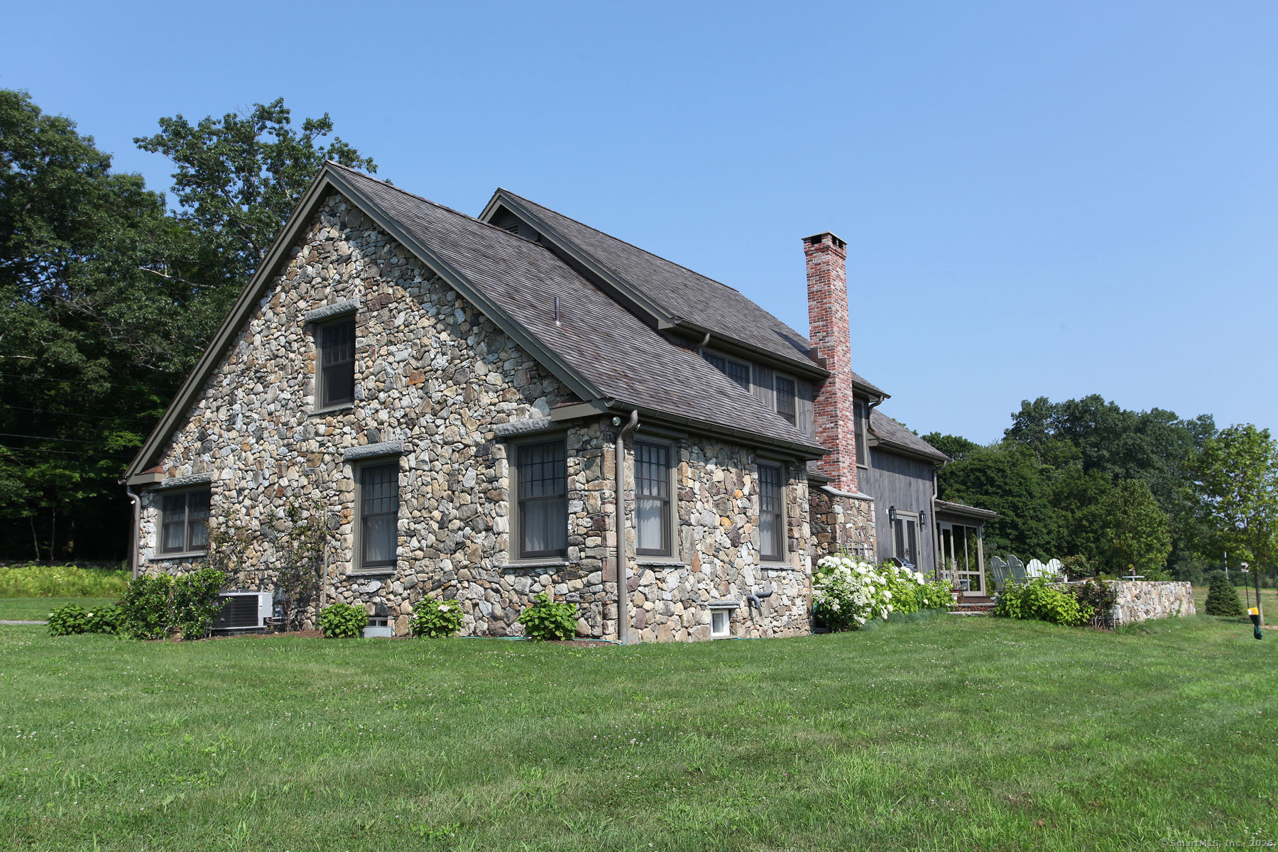 103 B Chalybes Road West Roxbury, CT 06783 - Photo 4 of 38 a front view of a house with a garden